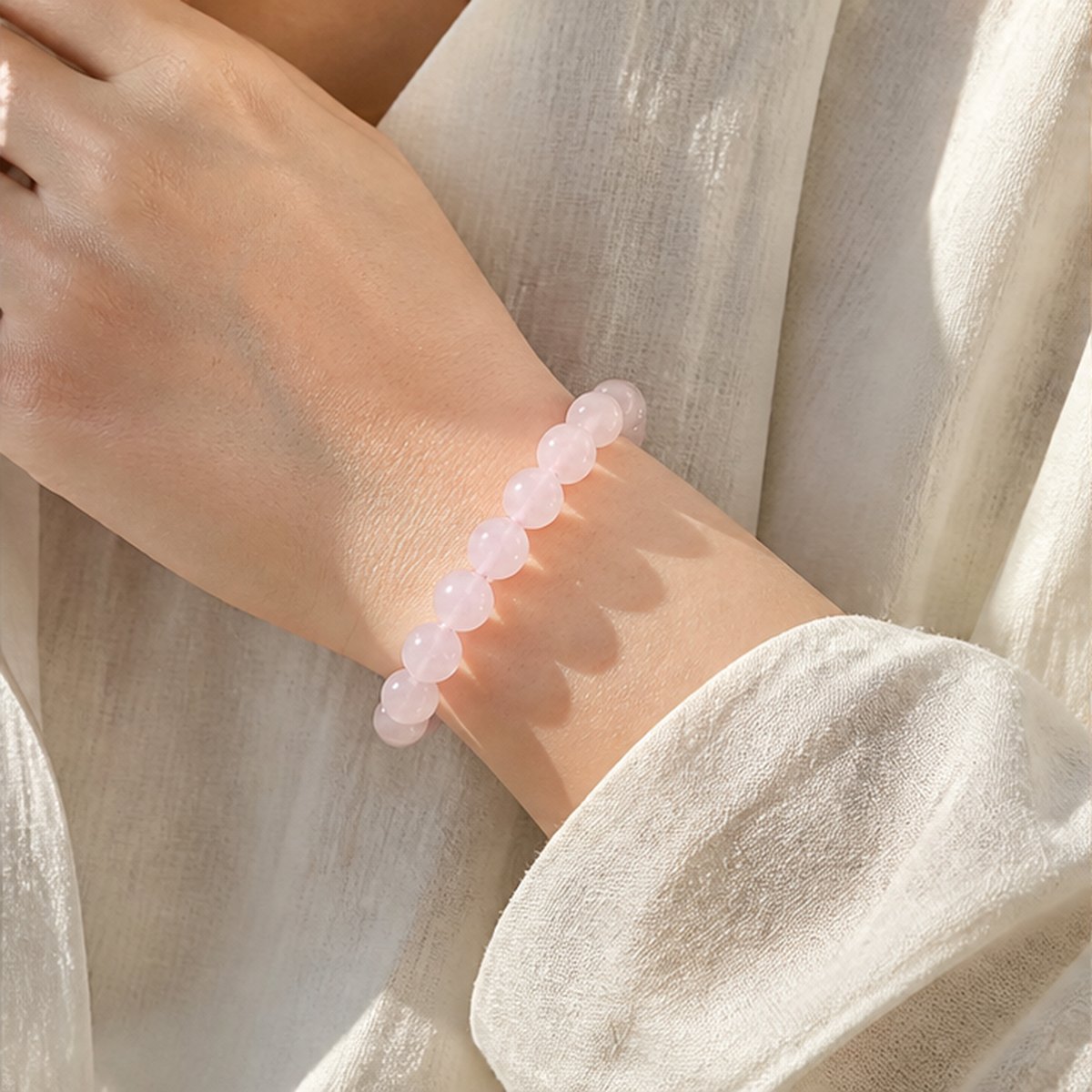 Rose quartz bracelet worn on wrist