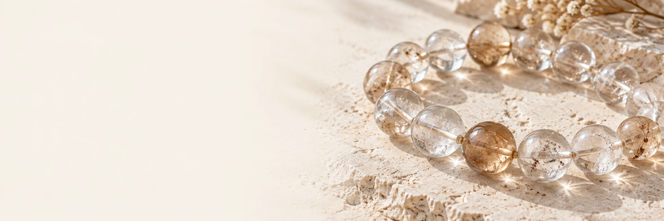 clear quartz crystals on warm ivory stone